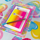 Image for article titled Would You Live in the Rainbow Explosion That Is the Hotels.com Lisa Frank SponCon Flat?